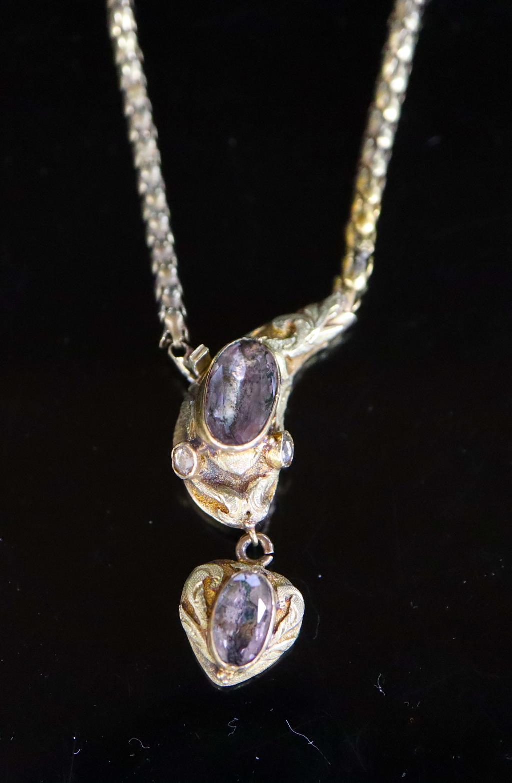 An early Victorian two colour gold and foil backed topaz? set mourning drop necklace,